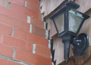 A tilting chimney in Wellington showing serious foundation damage.