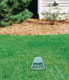 A buried gutter drain downspout extension installed in a Dania home